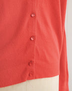 Rode cardigan met raglanmouwen uit de jaren 1960